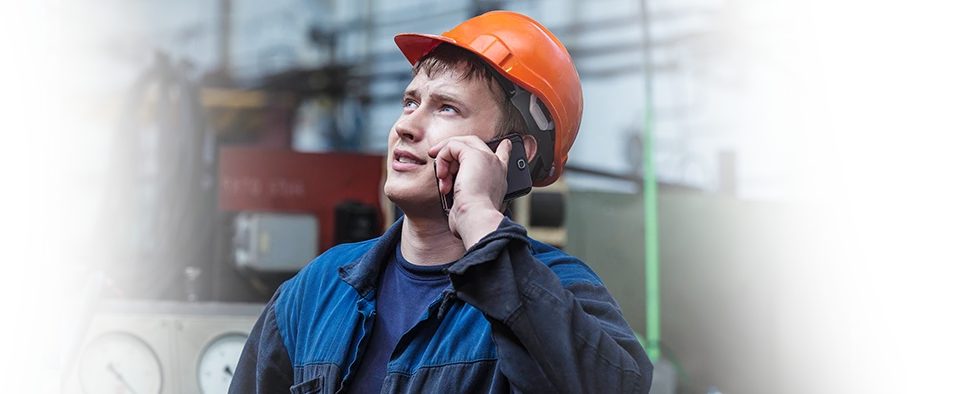 Man in hardhat on phone